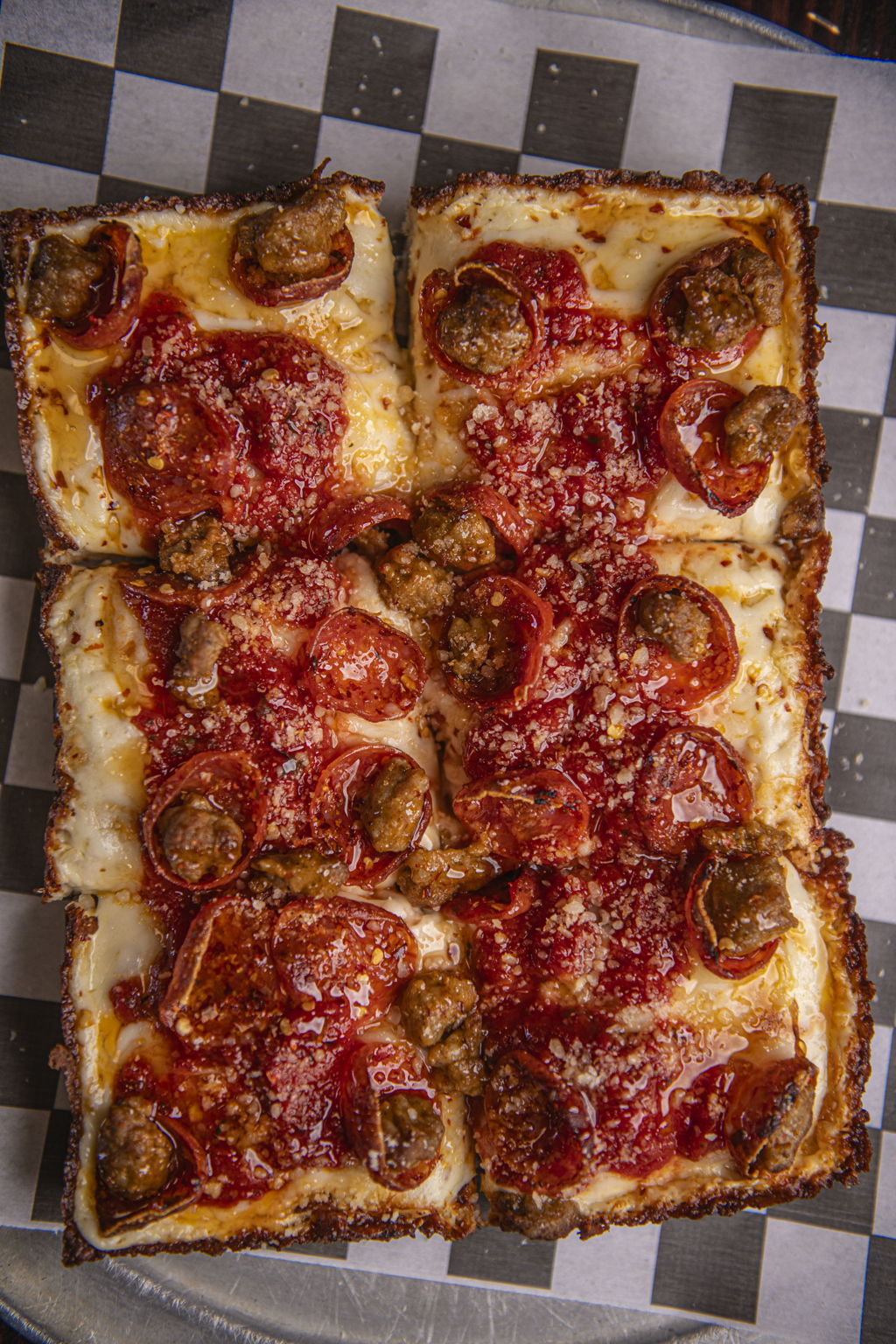Honey Badger Detroit-style deep dish pizza with pepperoni and sausage