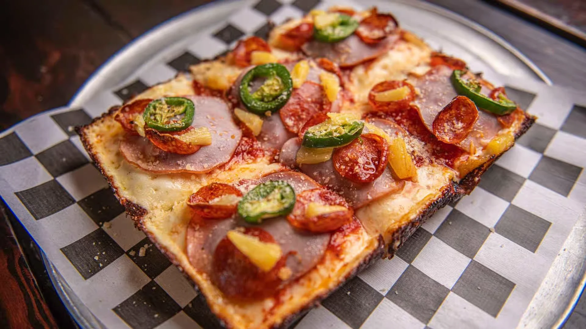 Maui Wowie deep dish with ham, pepperoni, pineapple and jalapeño