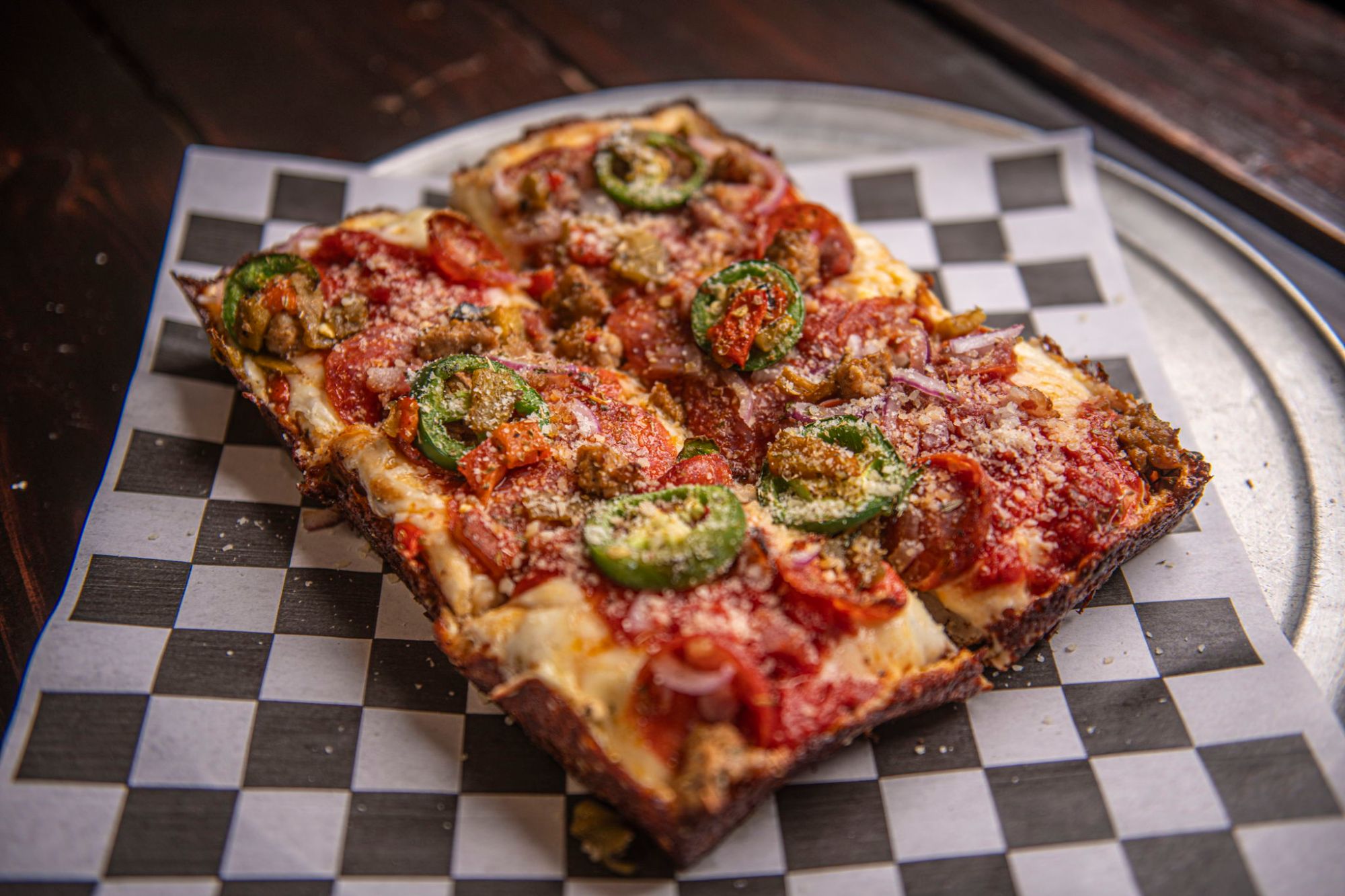 The TX Heat deep dish topped with fresh jalapeño rings